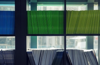 Shelves with coloured files on